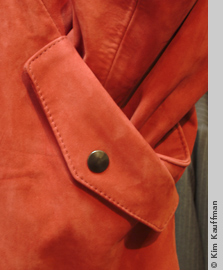 detail photograph of red leather coat by photographer kim kauffman for retail clothing store advertisement