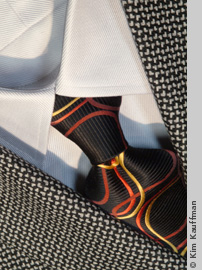 close up photo of tie and labels by still life photographer kim kauffman for mens clothing store promotion