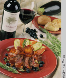 Food photography of lamb rosemary entree with wine by food photographer kim kauffman