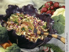 food photograph of a slaw dish featuring bowl and utensils by food photographer kim kauffman