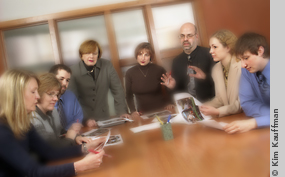 candid group photo of a marketing team by michigan photographer kim kauffman for an annual report